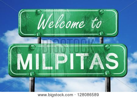milpitas vintage green road sign with blue sky background
