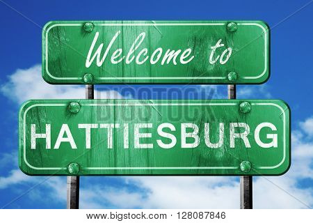hattiesburg vintage green road sign with blue sky background