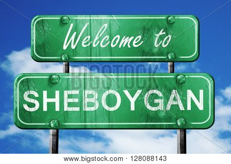 sheboygan vintage green road sign with blue sky background