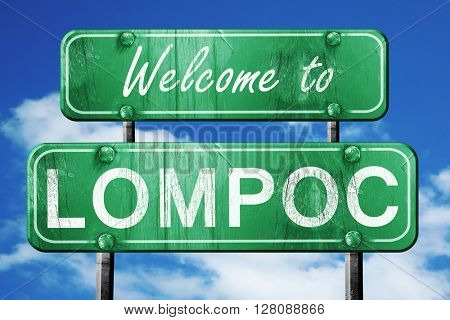 lompoc vintage green road sign with blue sky background