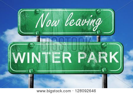 Leaving winter park, green vintage road sign with rough letterin