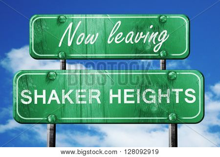 Leaving shaker heights, green vintage road sign with rough lette