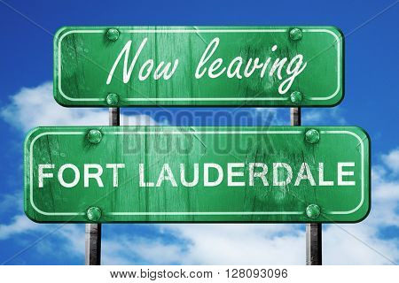 Leaving fort lauderdale, green vintage road sign with rough lett