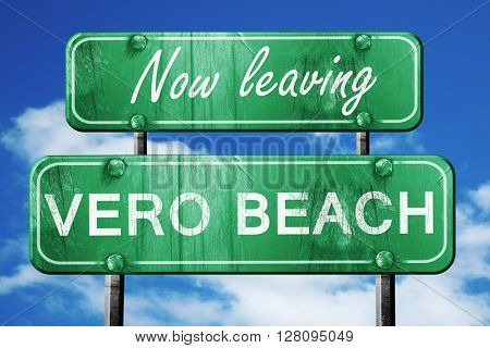 Leaving vero beach, green vintage road sign with rough lettering