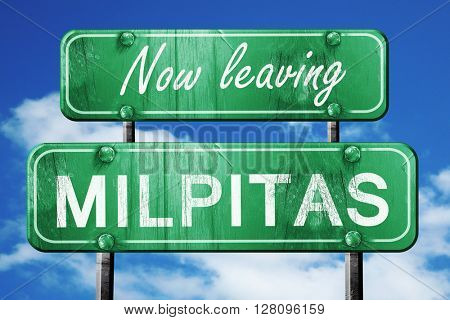 Leaving milpitas, green vintage road sign with rough lettering