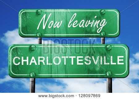 Leaving charlottesville, green vintage road sign with rough lett