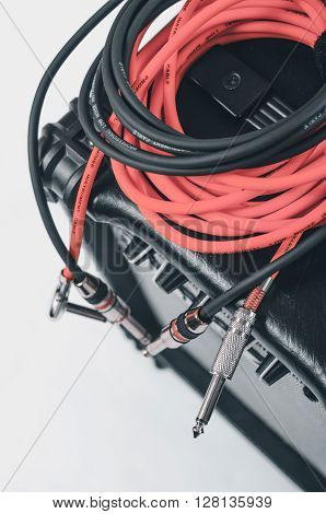 Close-up of guitar amplifier with jack cable.