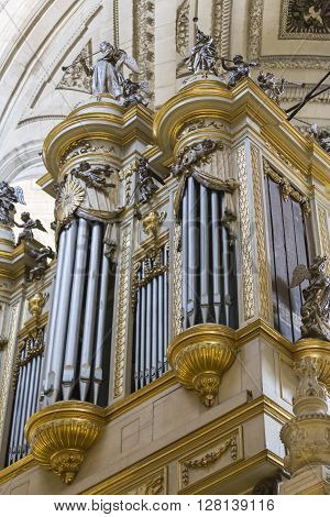 Jaen, Spain - may 2016 2: Monumental main organ inside the choir is one of the biggest of Spain, The organ this insert in baroque structure, is the work of Jose Garcia and Manuel Lopez (1870), Jaen, Spain