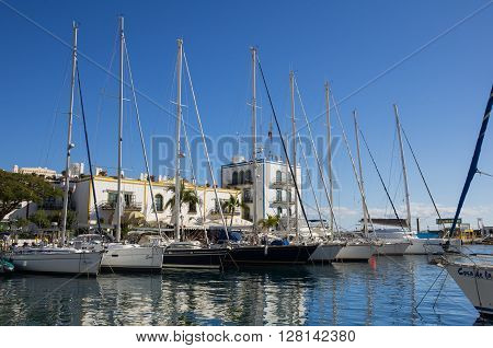 PUERTO DE MOGAN GRAN CANARIA CANARY ISLANDS - JANUARY 04 2014: Yachts in harbor of Puerto de Mogan a small fishing port and resort on Gran Canaria Island Spain
