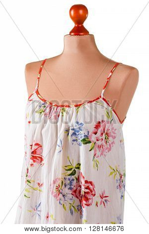 Casual sarafan with floral pattern. Floral sarafan on beige mannequin. Lady's fashionable summer clothing. New arrival at fashion store.