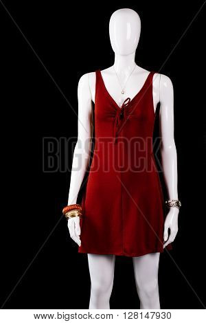 Short dress with keyhole neckline. Mannequin wearing short red dress. Lady's brand new evening apparel. Attractive clothing on sale.