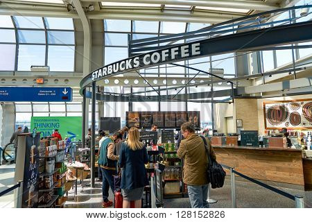 CHICAGO, IL - CIRCA APRIL, 2016: Starbucks Cafe at O'Hare Airport. Starbucks Corporation is an American global coffee company and coffeehouse chain based in Seattle, Washington