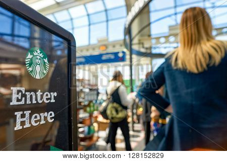 CHICAGO, IL - CIRCA APRIL, 2016: Starbucks Cafe at O'Hare Airport. Starbucks Corporation is an American global coffee company and coffeehouse chain based in Seattle, Washington