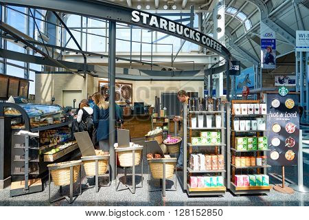 CHICAGO, IL - CIRCA APRIL, 2016: Starbucks Cafe at O'Hare Airport. Starbucks Corporation is an American global coffee company and coffeehouse chain based in Seattle, Washington