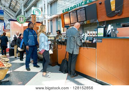 CHICAGO, IL - CIRCA APRIL, 2016: Starbucks Cafe at O'Hare Airport. Starbucks Corporation is an American global coffee company and coffeehouse chain based in Seattle, Washington