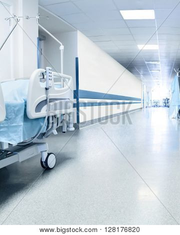 Surgical bed in hospital's corridor near operation room. Tinted picture