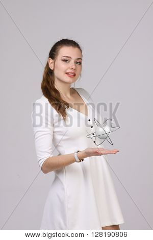 Woman scientist with atom model, research concept