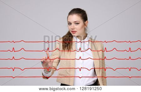 Doctor woman working with cardiogram lines
