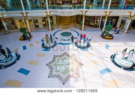 Dubai U.A.E. - February 18 2007: People and mannequins in the square of the Wafy City Mall