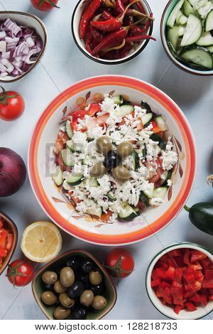 Shopska salad with cheese, tomato, cucumber, onion and olives
