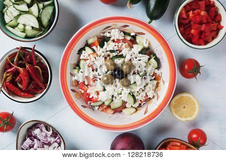 Shopska salad with cheese, tomato, cucumber, pepper and olives