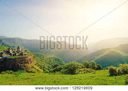 Ancient monastery in setting sun. Tatev. Armenia