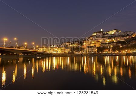 Coimbra by Mondego river in Portugal in the evening