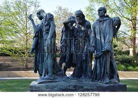 WASHINGTON, DC - APR 16: Les Bourgeois de Calais sculpture by Auguste Rodin at the Hirshhorn Sculpture Garden in Washington, DC, on April 16, 2016. In 2013, the Sculpture Garden drew 645,000 visitors.