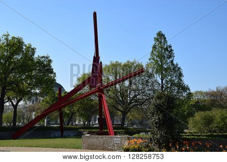 WASHINGTON, DC - APR 16: Are Years What sculpture by Mark di Suvero at the Hirshhorn Sculpture Garden in Washington, DC, on April 16, 2016. In 2013, the Sculpture Garden drew 645,000 visitors.