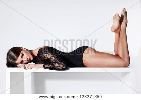 Young prettywoman laying in sexy lacy bodysuit