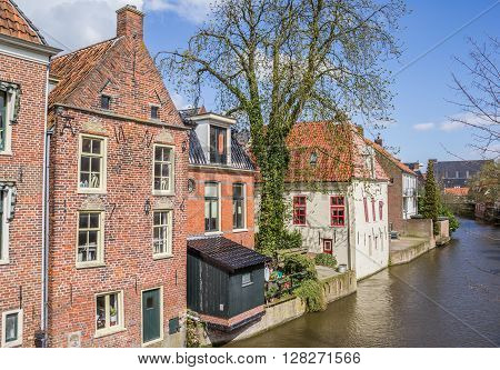 Old houses along a canal in Appingedam Netherlands