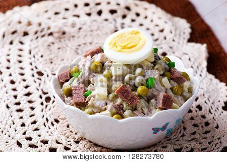 salad with veal tonque and mayonnaise. selective focus