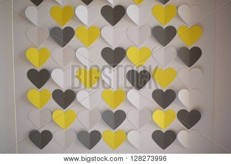 Coloured yellow and black heart shaped papercuts