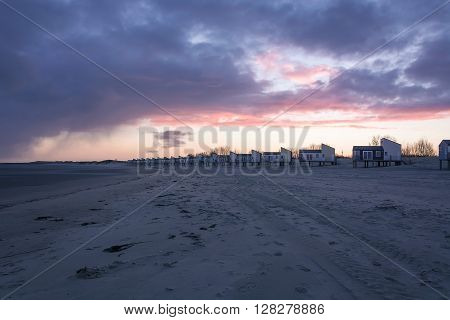 Dawn and holiday houses on the bay.