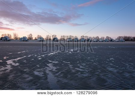 Dawn and holiday houses on the bay.