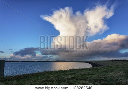Evening sunset clouds in the quaint traditional Dutch landscape.