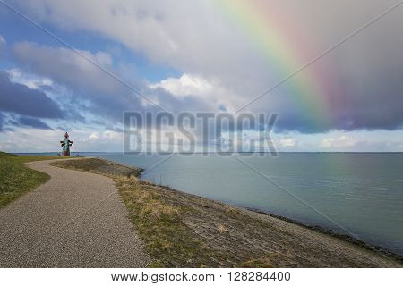 A bicycle trail lined along the shore of the river mouth. Monument dedicated to the flood occurred in the province.