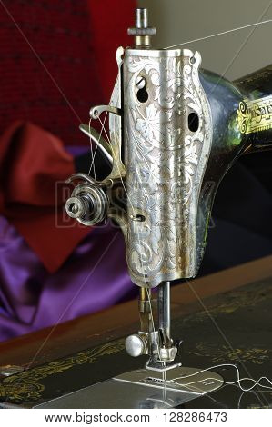 Kozmice Male, Poland, April 30, 2016. Private sewing workshop. Singer sewing machine, serial number Y-5.203.193. Manufactured in 1927 by Singer factory in Clydebank, Scotland.