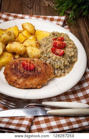 Delicious Meal Of Minced Meat Cutlet, Potatoes And Fried Cabbage.