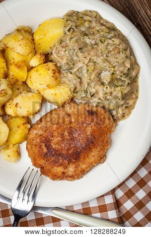 Delicious Meal Of Minced Meat Cutlet, Potatoes And Fried Cabbage.
