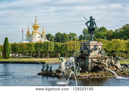 Petergof St Petersburg Russia - September 1 2012: View of Neptune fountain and orthodox palace church in Petergof