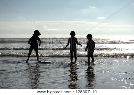 Children playing on a Cornish beach during summer