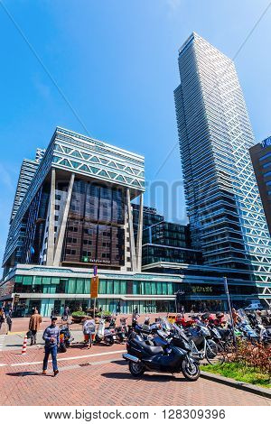 The Hague Netherlands - April 21 2016: forecourt of the main station with unidentified people. It is with twelve tracks the largest terminal station in the Netherlands. It was completed in 1973