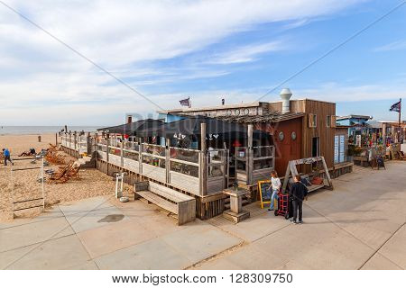 Scheveningen Netherlands - April 21 2016: beach bar in Scheveningen with unidentified people. From a small fishing village Scheveningen developed to the largest seaside resort i Netherlands