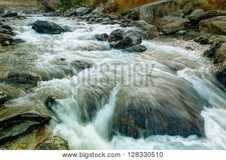 Beautiful Reshi River water flowing through stones and rocks at dawn Sikkim India. Reshi is one of the most famous rivers of Sikkim flowing through the state and serving water to many local people.