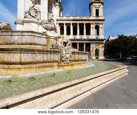 Color DSLR stock image of Church of Saint-Sulpice, Paris, France in the St. Germain district. Fountain in the foreground