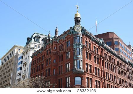 WASHINGTON DC - APR 17: Historic SunTrust building in Washington DC, as seen on April 17, 2016. The building is constructed in red brick, and elaborately detailed with copper and terra cotta.