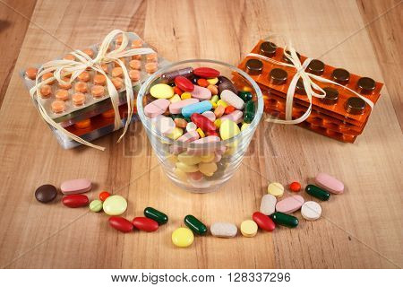 Colorful medical pills and capsules for therapy and blisters of tablets or supplements concept of treatment and health care