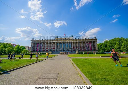 BERLIN, GERMANY - JUNE 06, 2015: Unidentified people playing and enjoying outside of Altes Museum, summer nice day, museum island
