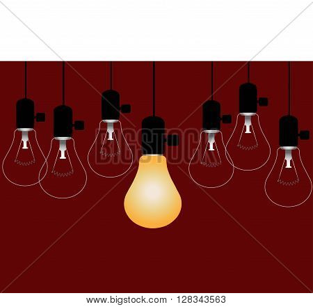 Bright Spot  - Lighted light bulb among a group of unlighted lamps